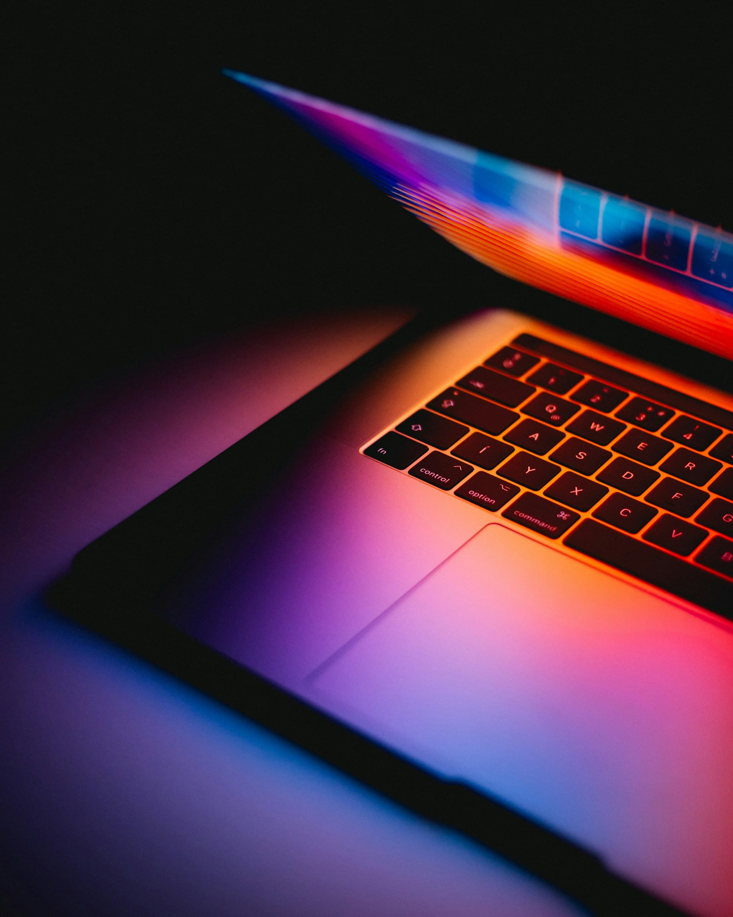 A MacBook keyboard photographed at a low angle